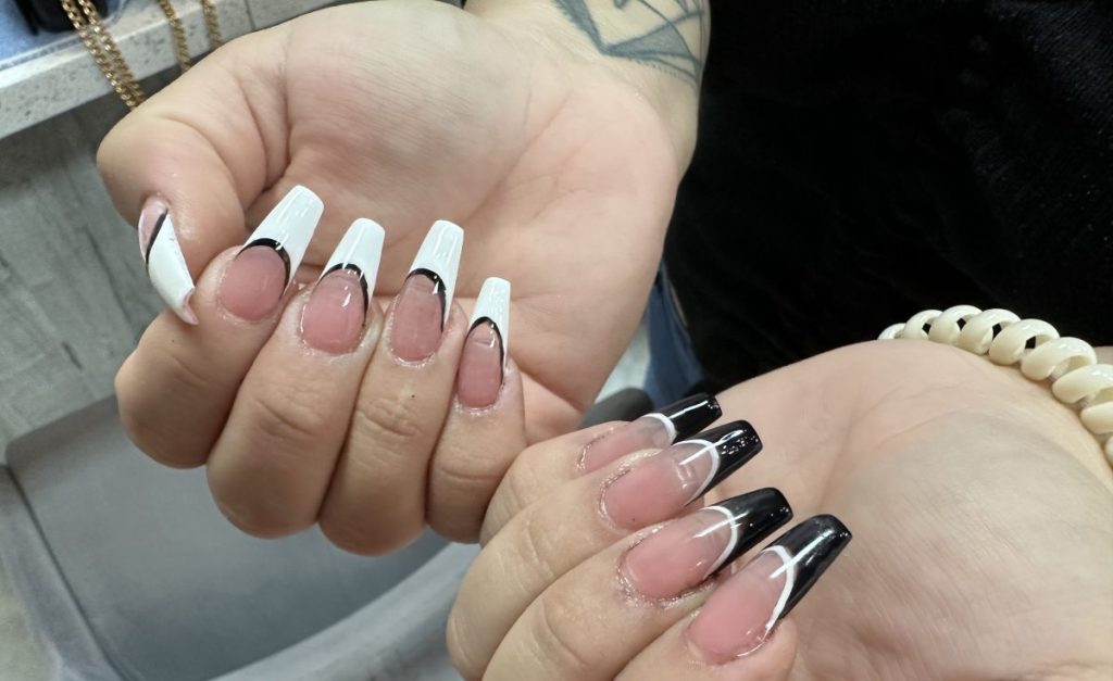 Featuring white and black deep French manicure