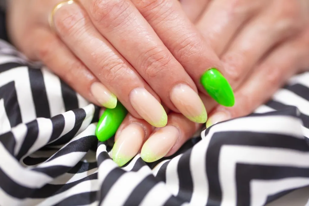 Featuring neon deep French nail tips