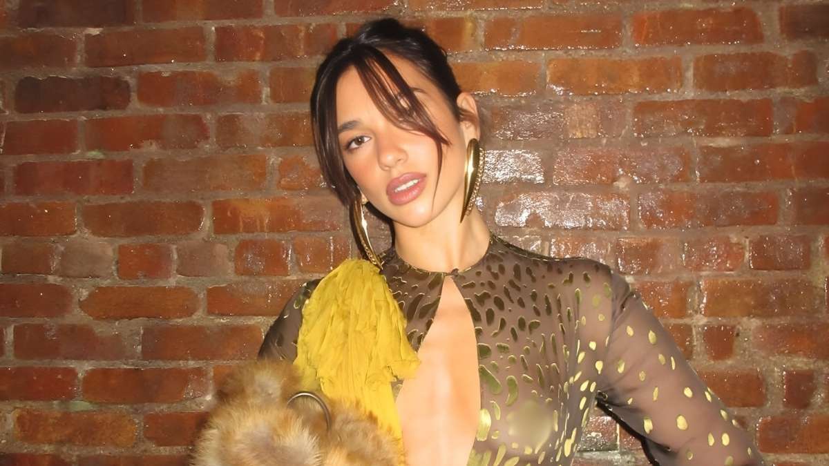 Dua Lipa Swaps Gucci Fit for Completely Sheer Top With Huge Cutout -  theFashionSpot