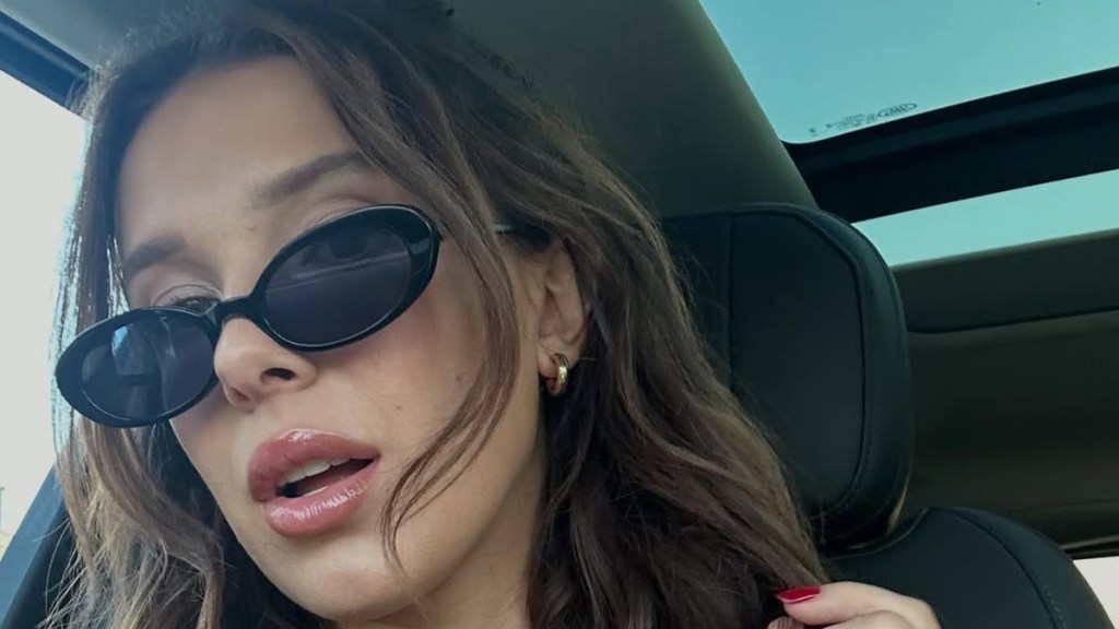 Millie Bobby Shows off Bikini by Playfully Lifting Her Tee in Photo
