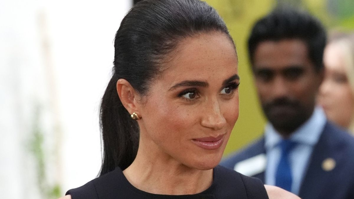 Meghan Markle Keeps It Elegant & Chic in Sleeveless Karen Gee Midi Dress
