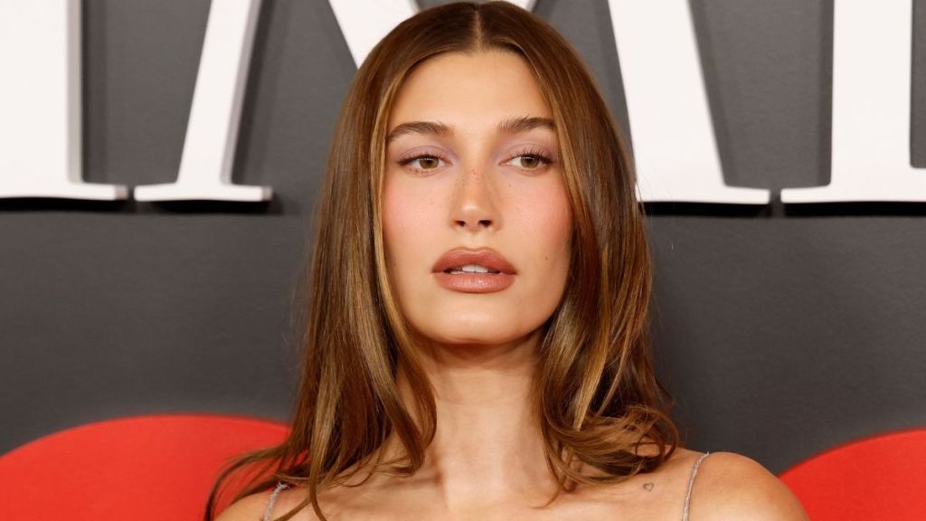 Hailey Bieber Drops Jaws by Tucking Rhode Into Her String Bikini