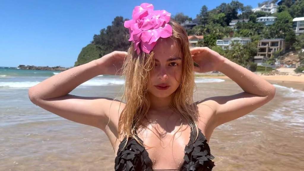 Addison Rae Flaunts Her Flexibility on the Beach in Skimpy String Bikini