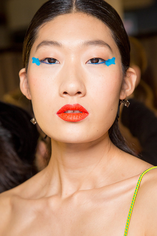 Blue Eyeliner and Orange-Red Lipstick